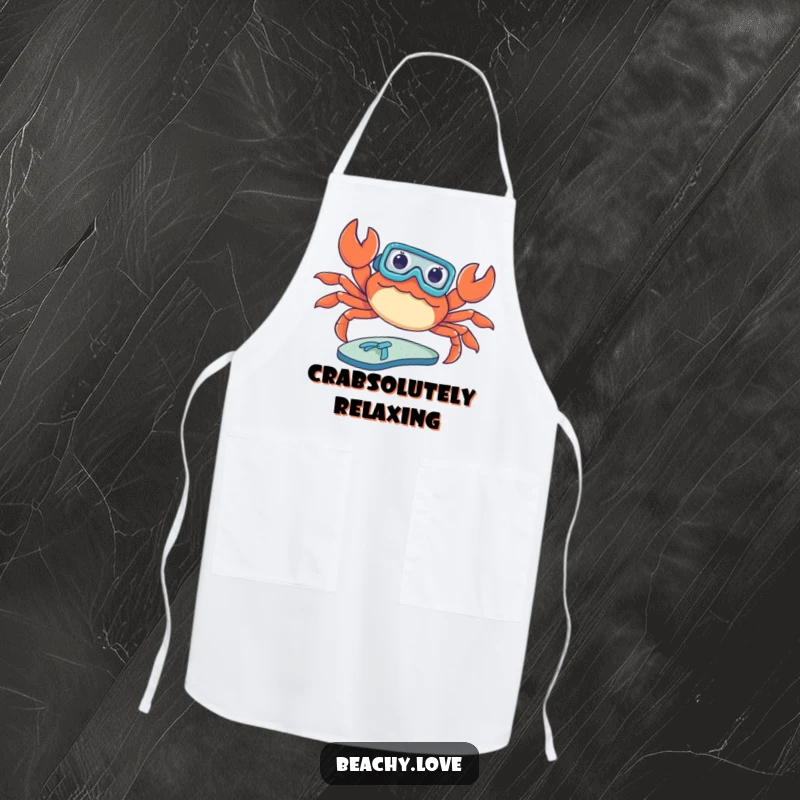 Funny apron featuring a crab wearing a tiny snorkel, attempting to sunbathe on a flip-flop. Humorous kitchen accessory for beach-themed cooking. Great design.