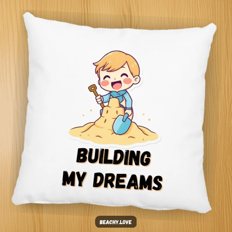 Funny pillow with a tiny character gleefully building a sandcastle with a small shovel, offering comfort and a playful beach theme.