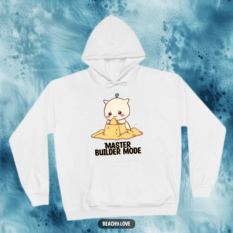 Funny kawaii character building a sandcastle, depicted on a cozy hoodie, perfect for chilly beach evenings and humorous comfort.