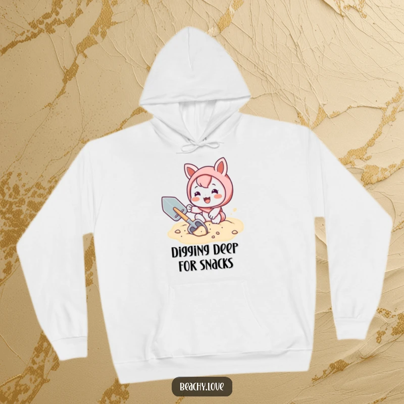Funny hoodie with a kawaii character joyfully digging in the sand with a shovel, radiating warmth and playful energy.