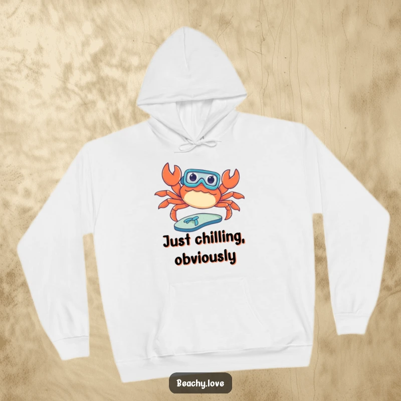 Funny hoodie with a crab wearing a tiny snorkel, attempting to sunbathe on a flip-flop. Cozy and humorous beach-themed apparel. Great design.