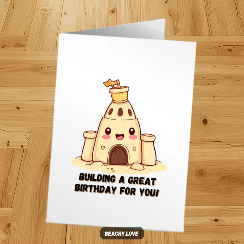 Funny Free Printable Birthday Card: A happy sandcastle wearing a bucket and spade on its head, celebrating.
