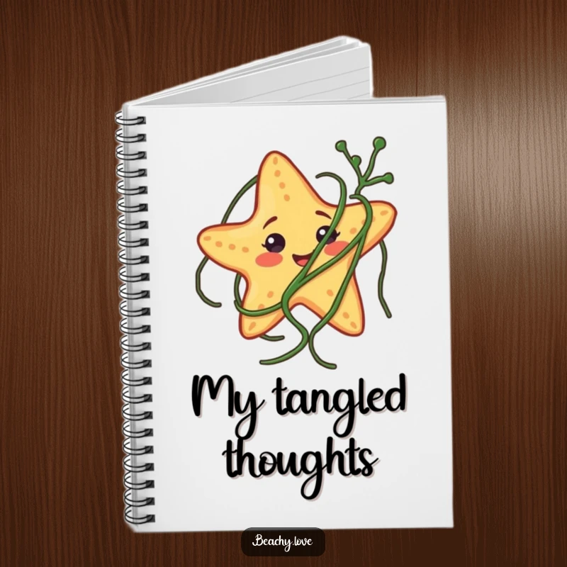 Funny notebook with a smiling starfish comically tangled in seaweed, perfect for jotting down notes with a humorous beach theme.