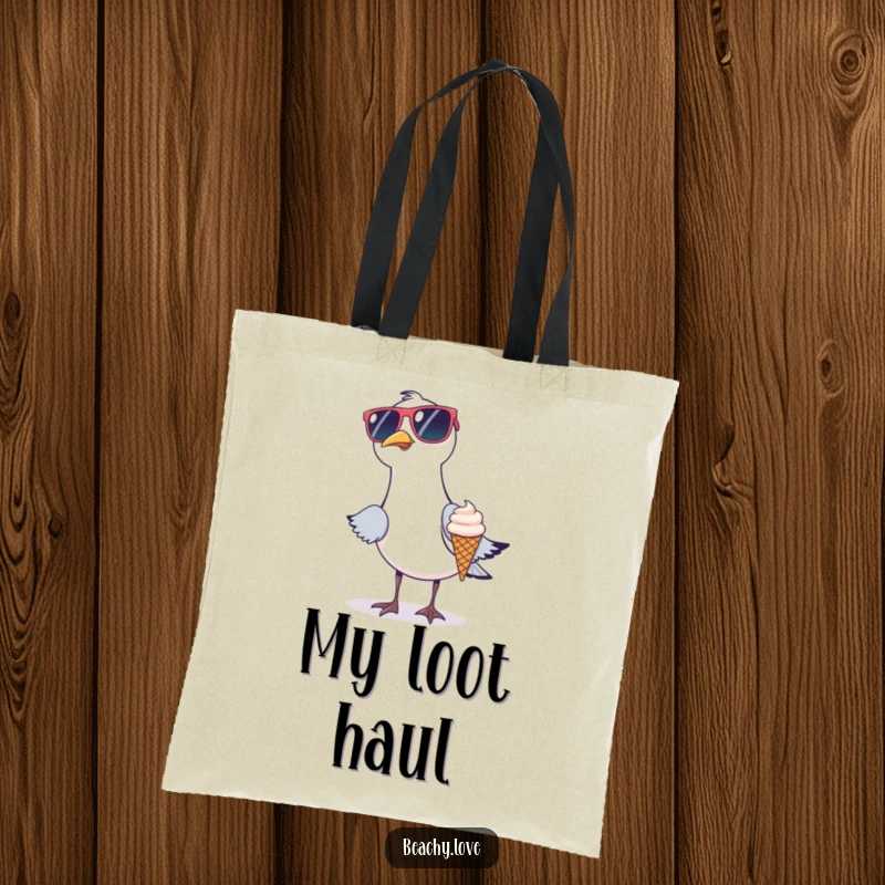 Funny tote bag depicting a seagull in oversized sunglasses stealing a tiny ice cream cone. Humorous beach accessory for carrying essentials. Great graphic.